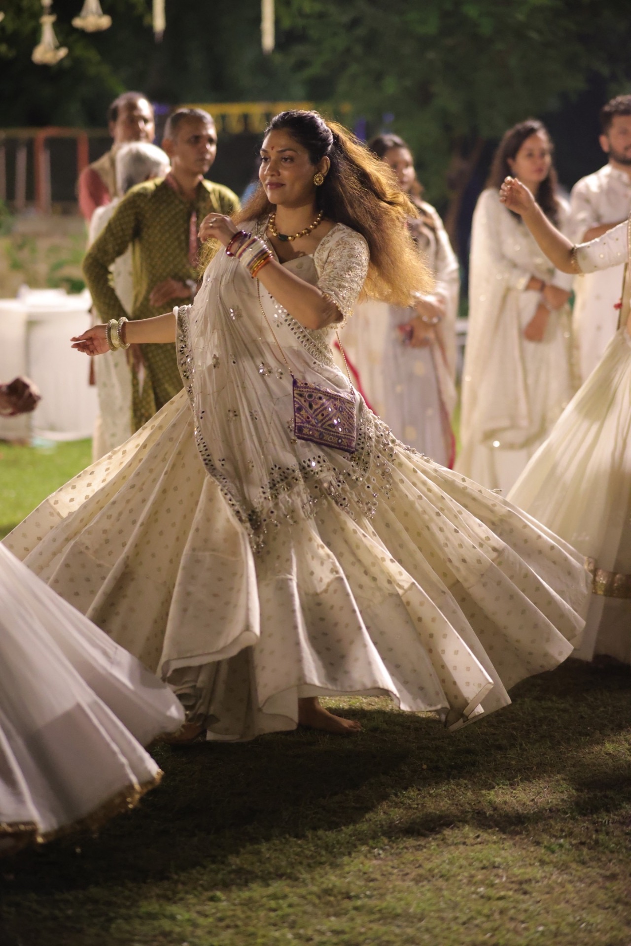 Woman twirling in ivory